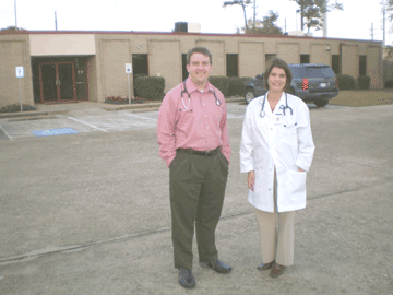 Two Drs stood outside Neighborhood Health Center